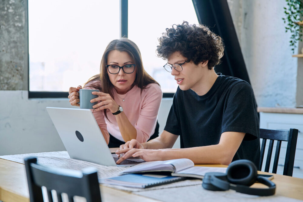 Teen boy receiving academic support as part of a Dual Diagnosis Teen Treatment program.